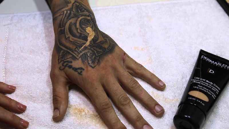 Are tattoos visible on dark skin