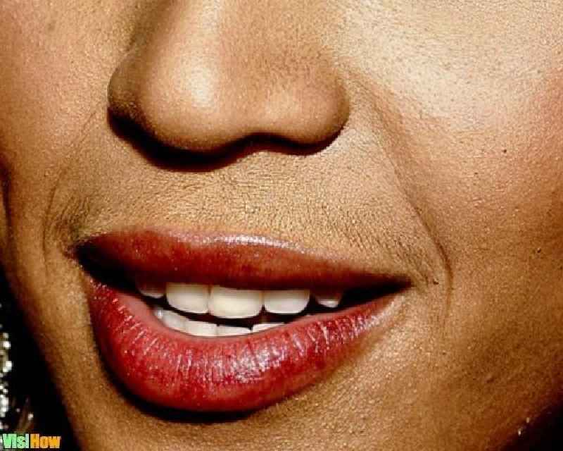 How can a woman stop growing facial hair