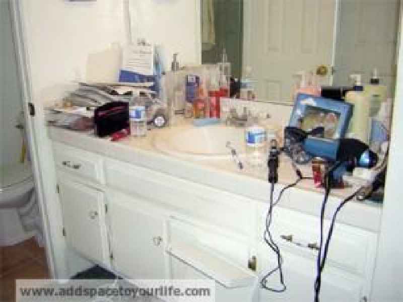 How do I hide the clutter in my bathroom