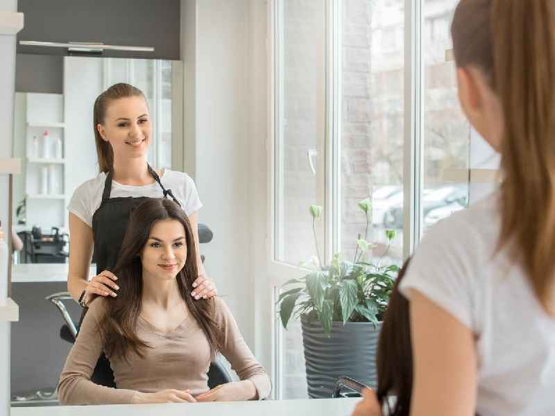 How do you perform a client consultation in a beauty salon