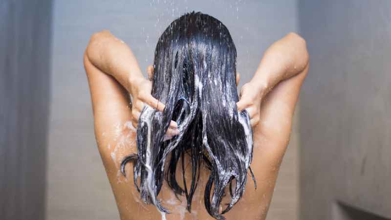 How often should I spray my natural hair with water