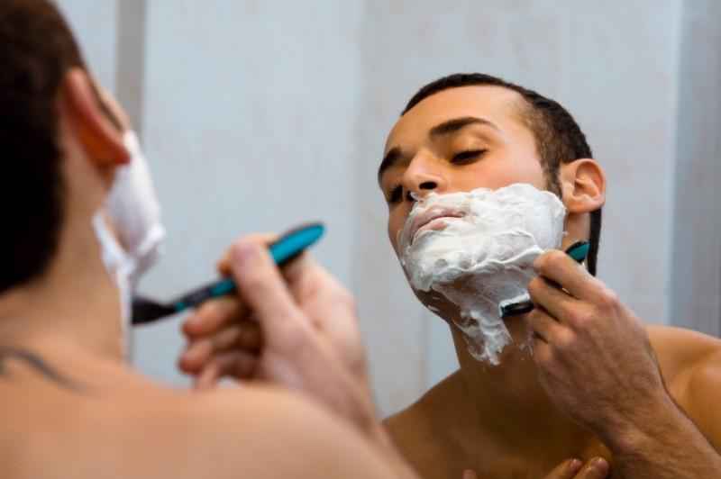 How should a man clean his face