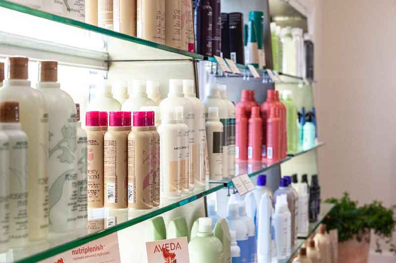 What are the benefits of promoting products and services in a salon