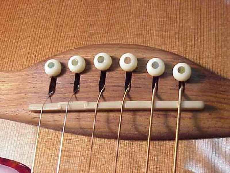 What is a movable guitar bridge called